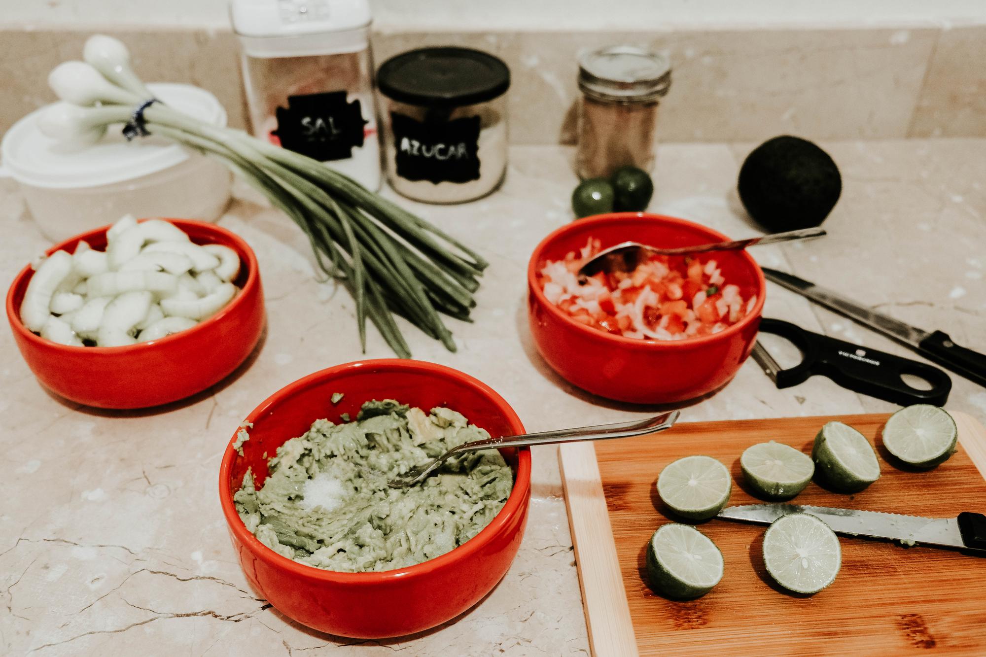 Small kitchen workspace with bowls and herbs