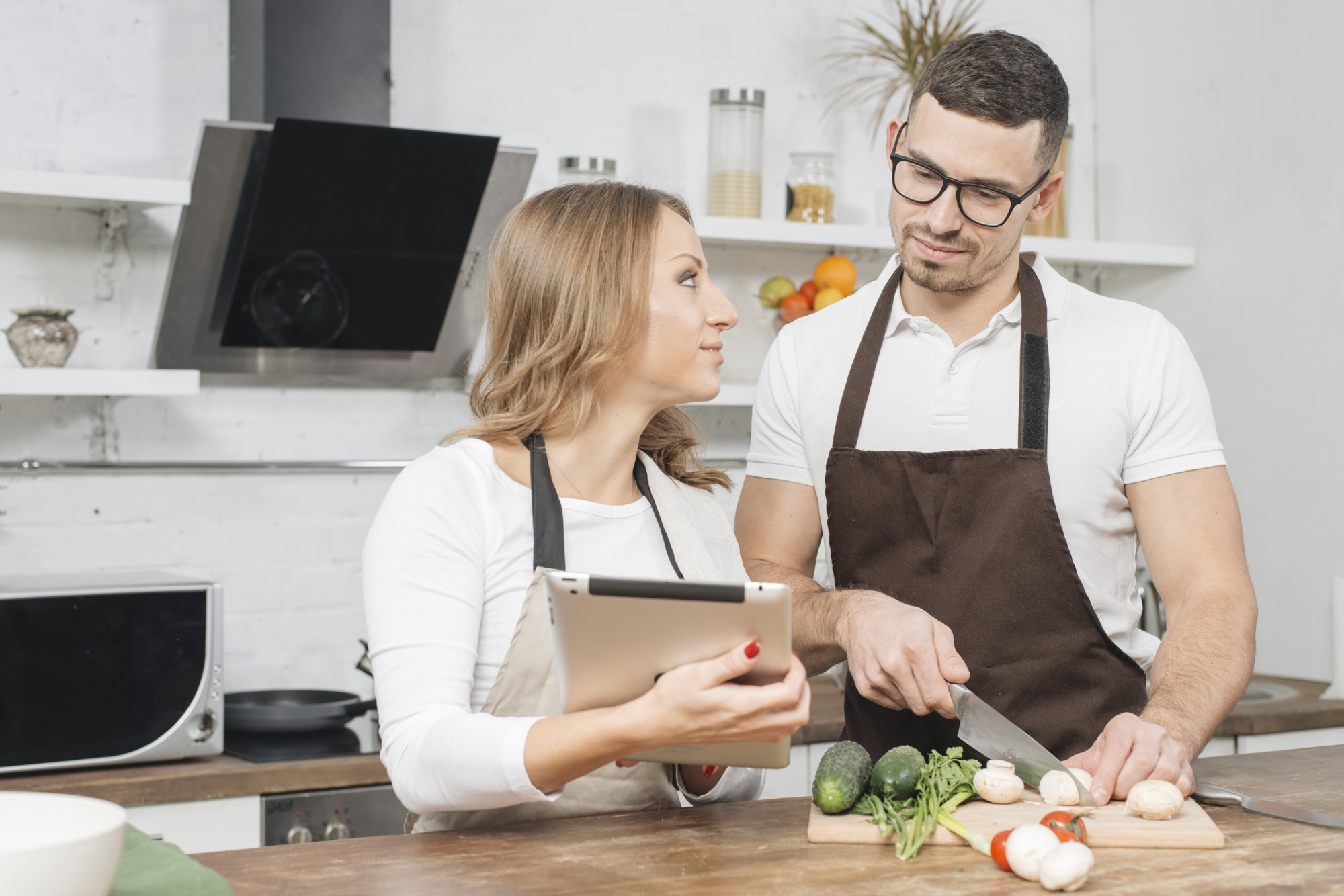 Chef consulting with client in small kitchen
